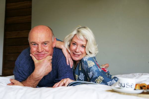 12365220 - senior couple enjoying breakfast in bed